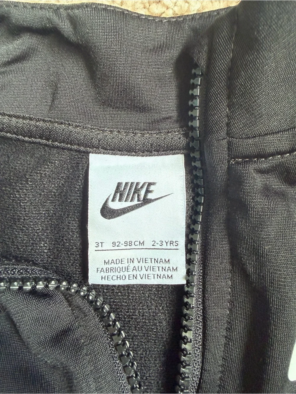 Nike Black Kids Zip-Up Track Jacket with White Logo Stripe